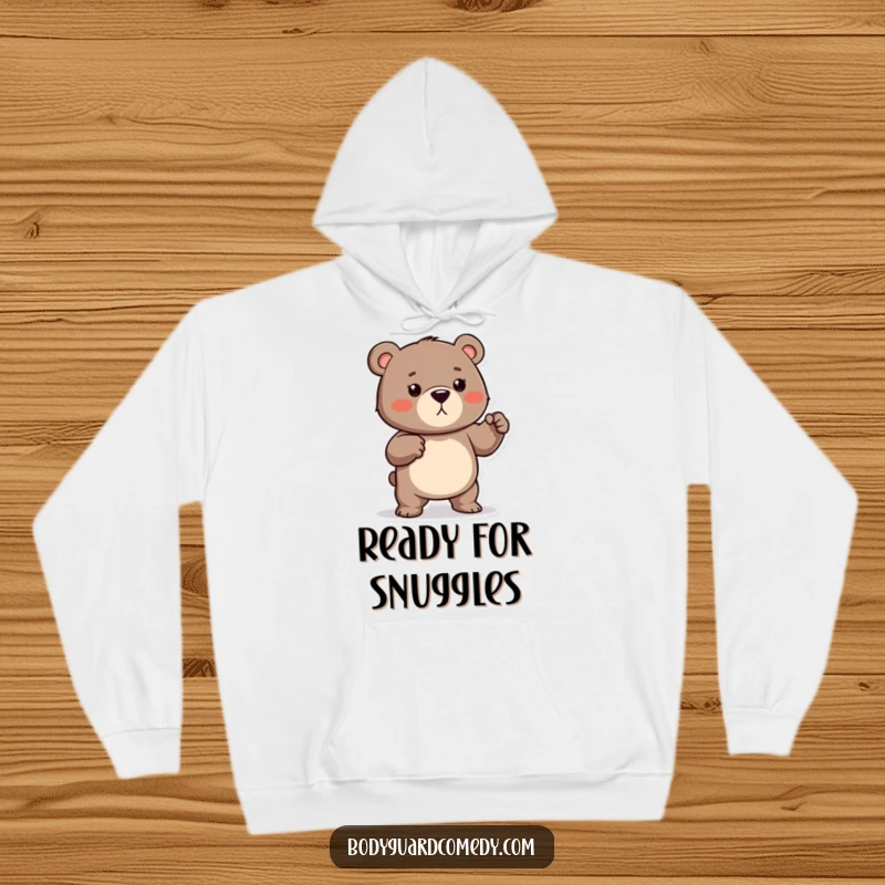 Funny hoodie featuring a protective bear playfully flexing tiny muscles, looking ready to defend with a humorous and strong vibe.
